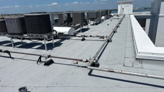 Typical commercial rooftop with A/Cs & pipe